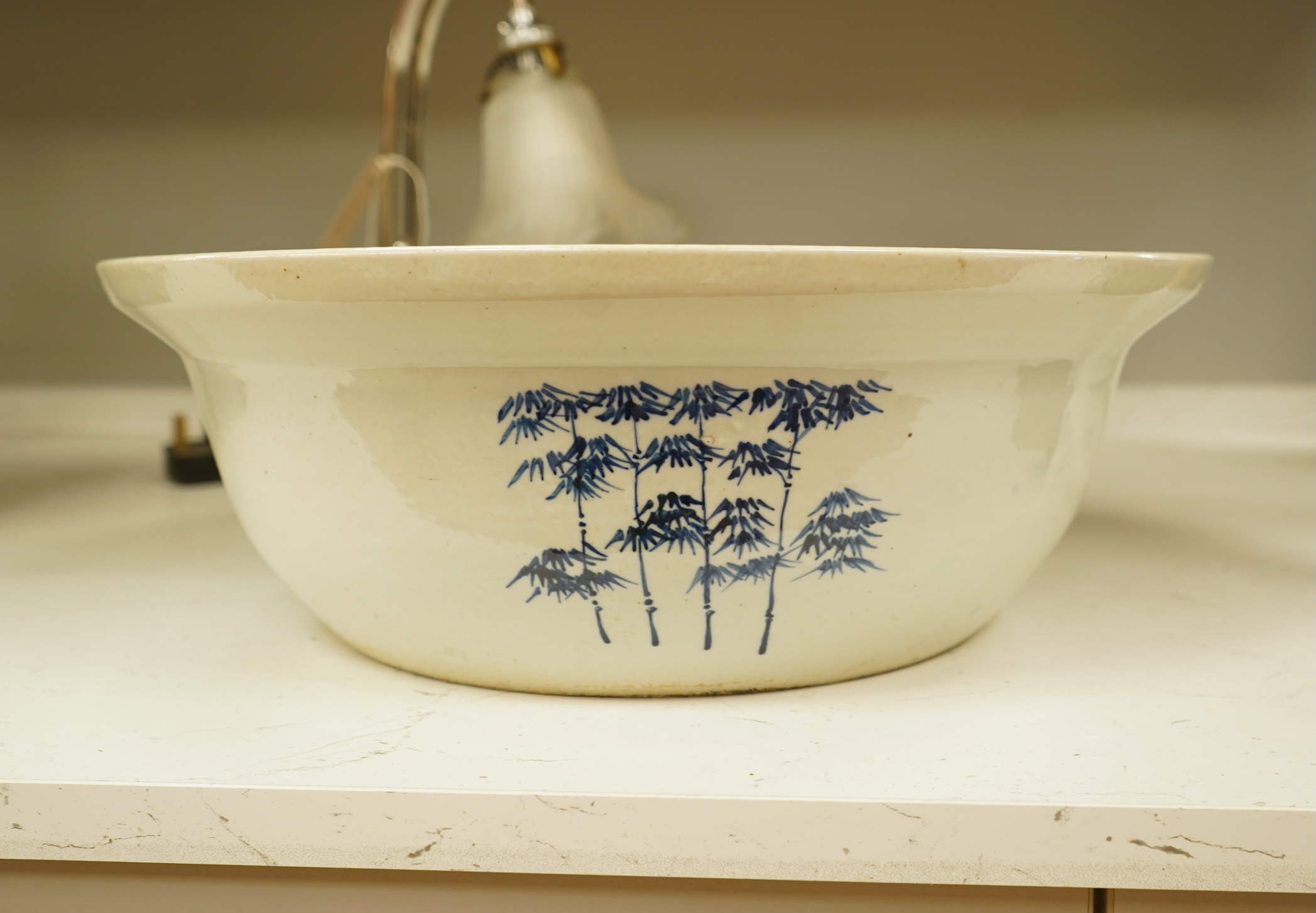 A large Chinese porcelain basin enamelled with figures, 41cm in diameter